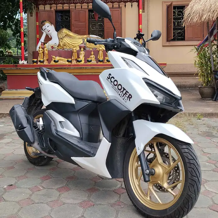 scooter huhb honda click 160 at a local temple